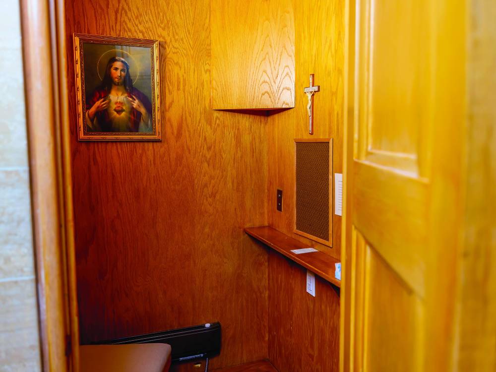 A picture of jesus in the corner of a room.